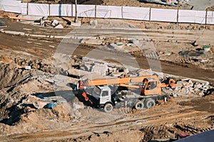 Mobile Crane Of Jib Type On City Building Site. Construction Of Houses