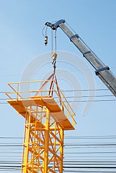 Mobile crane lifting a structure