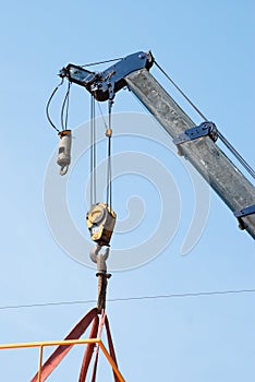 Mobile crane lifting a structure