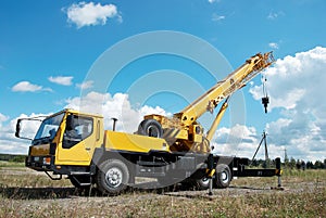 Mobile crane with risen boom photo