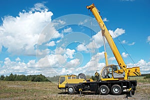 Mobile crane with risen boom photo