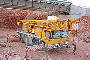 Mobile Crane under a bridge