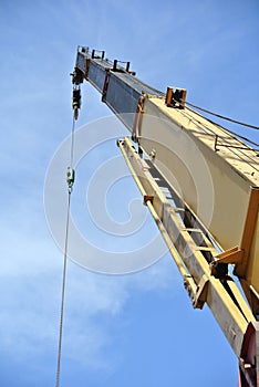 Mobile crane used to lifting heavy material at construction site