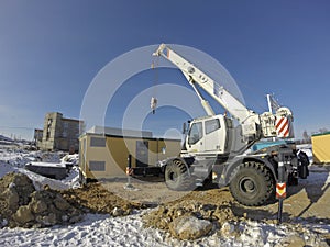 Mobile crane in work at a construction site