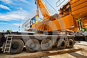 Mobile crane at work at downtown construction site