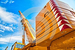 Mobile crane at work at downtown construction site