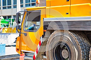 Mobile crane at work at downtown construction site