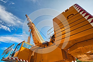 Mobile crane at work at downtown construction site