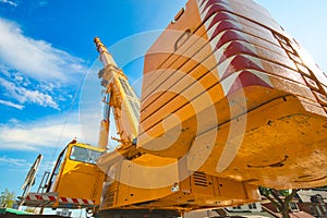 Mobile crane at work at downtown construction site