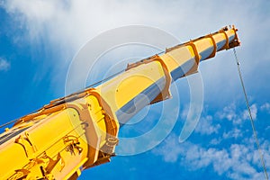 Mobile crane at work at downtown construction site