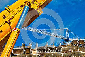 Mobile crane at work at downtown construction site