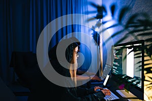 Mobile developers team writes program code on a computer, programmers work in home office