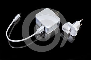 Mobile devices charger with combined AC plug and connected cable