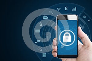 Mobile device security system. Hand holding mobile smart phone with lock and application icons. on blue background with copy space