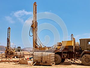 Mobile drilling rigs on vehicles at construction site