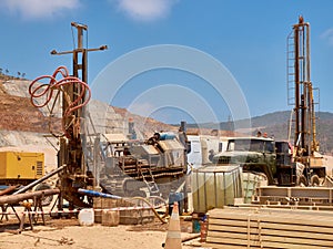 Mobile drilling rigs on vehicles at construction site