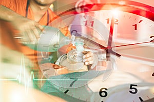 mobile emergency medical team speed help injured race against time concept. paramedics working resuscitator overlay times clock photo