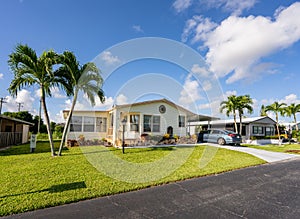 Mobile homes with palm trees. Photo of low income housing development in Florida USA