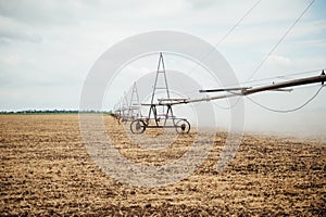 Mobile irrigation pivot watering a field