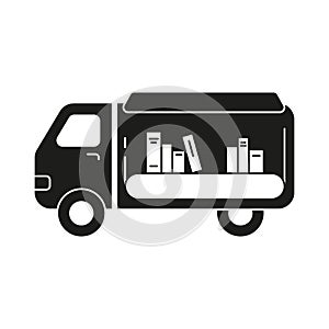 Mobile library silhouette icon. Black simple pictogram of van with canopy and books photo