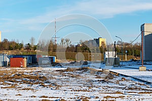 Mobile metal containers for the placement of a work crew on a construction site in winter. A temporary residential town of