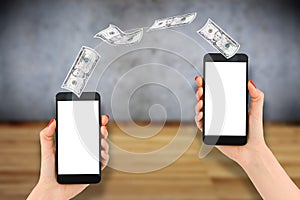 Mobile payment or money transfer with smartphone, wooden background