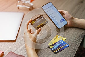 Mobile payments. hands using smartphone and credit card for online shopping