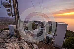 Mobile phone base station located on the mountain above the Aegean Sea