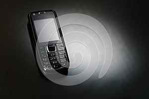 Mobile phone on a black