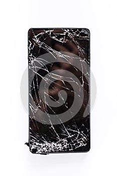 Mobile phone with broken screen photo