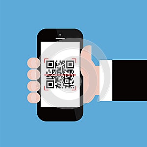 Mobile phone in businessman hand scanning qr code