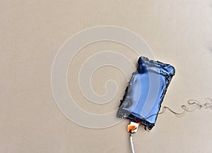 Mobile phone caught fire from the wire with recharging from the electrical network in the socket. Inexpensive chargers put your