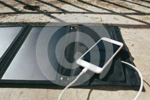 Mobile phone is charging from the solar panel