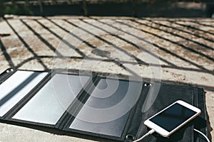 Mobile phone is charging from the solar panel