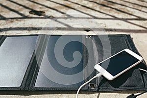 Mobile phone is charging from the solar panel