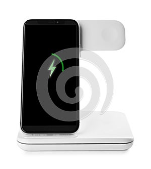 Mobile phone charging with wireless pad on white