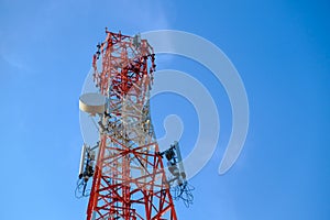 Mobile phone communication antenna tower with the blue sky and c