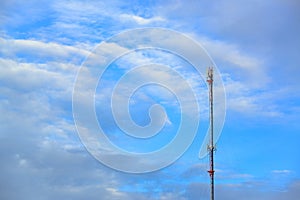 Mobile phone communication antenna tower with the blue sky and c