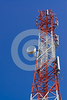 Mobile phone communication antenna tower with satellite dish on