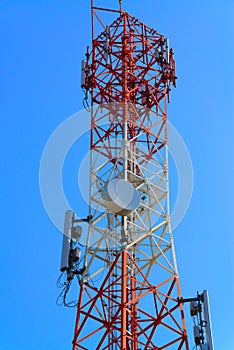 Mobile phone communication antenna tower with satellite dish on