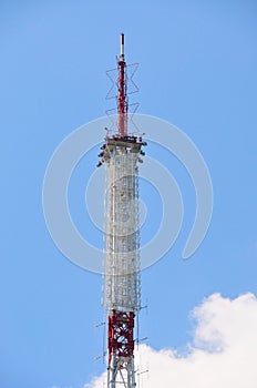 Mobile phone communication repeater antenna tower in blue sky