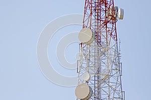 Mobile phone communication tower transmission with blue sky back