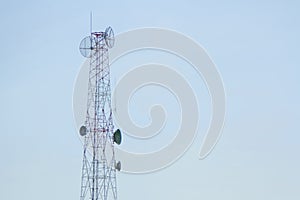 Mobile phone communication tower transmission with blue sky back