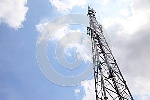 Mobile phone communication tower transmission signal with blue sky and antenna