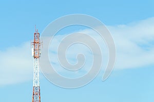 Mobile phone communication tower transmission  signal with blue sky background and antenna