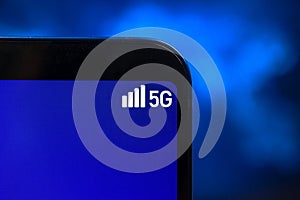 Mobile phone connected to 5G network wireless system. Concept of high speed mobile internet, new generation networks