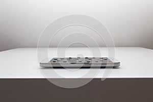 Mobile phone with drops on oleophobic screen.