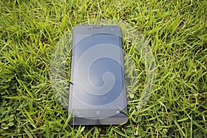 Mobile phone on grass