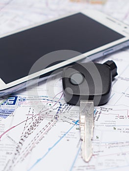 Mobile phone and key car on the map.