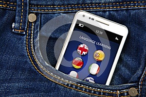 Mobile phone with language learning application in jeans pocket